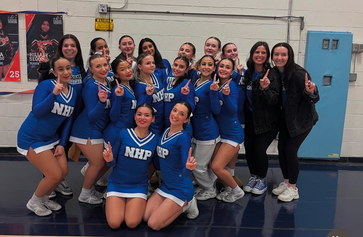 The varsity cheer team celebrates their win at Great Neck North High School. (Source by @nhpvarsitycheer on Instagram) 