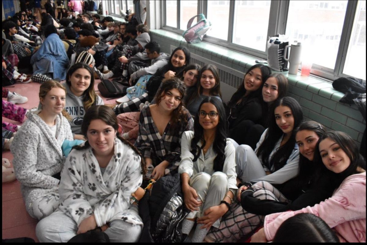 A group of seniors laze around the dead hallway.