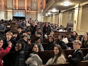 Delegates sit at opening ceremony, awaiting their first day of debate.