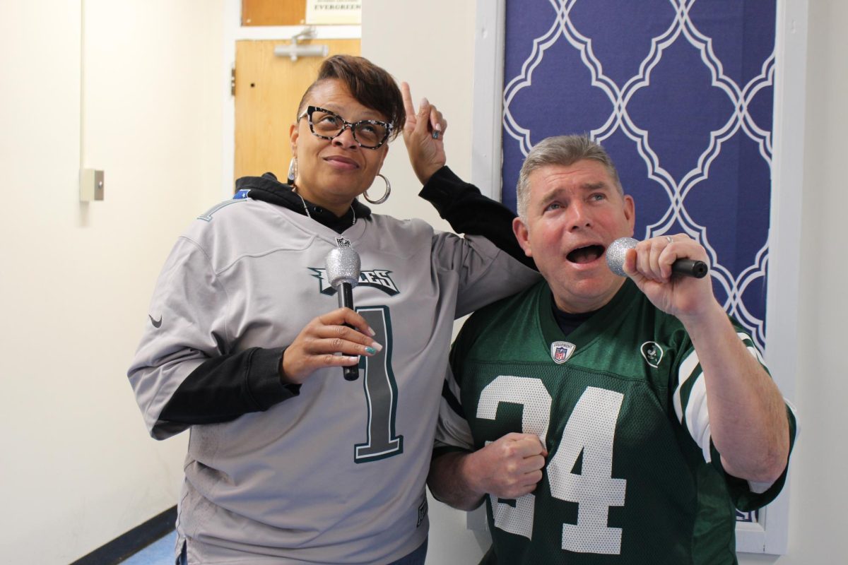 With energy, talent and stage presence, science teacher Ms. Phillip and  math teacher Mr. Basilcould easily steal the spotlight during the Super Bowl. (Source by Mary Kay Mannle)
