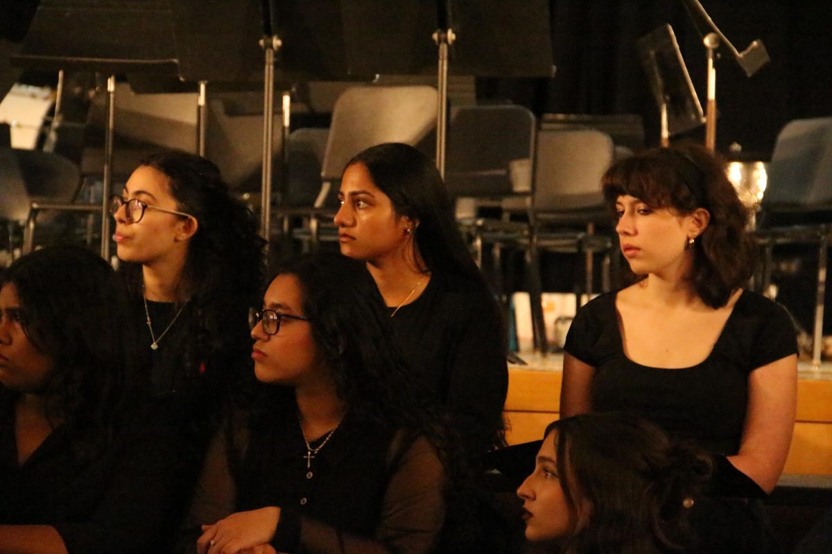 The Senior High Chorus delivers a lively  performance as part of the school's annual spring concert, showcasing their hard work and musical talent.
