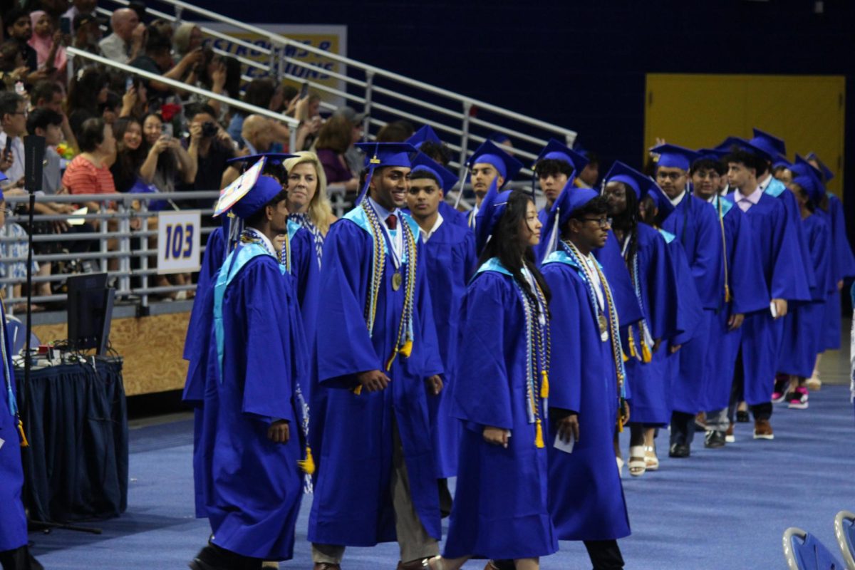 NHP Class of 2025 enters the stadium with a range of emotions as their graduation ceremony begins. 