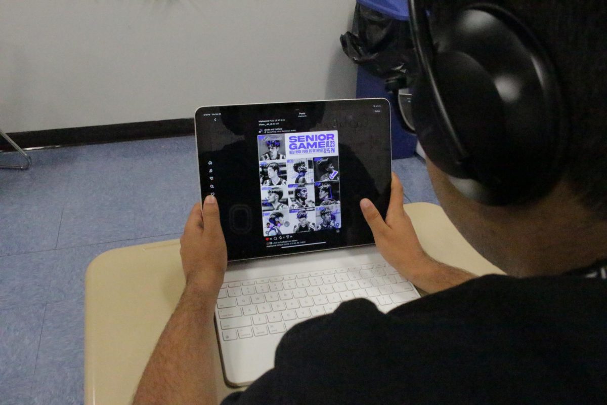 NHP student scrolls Instagram to stay updated on his favorite NHP varsity sports teams.