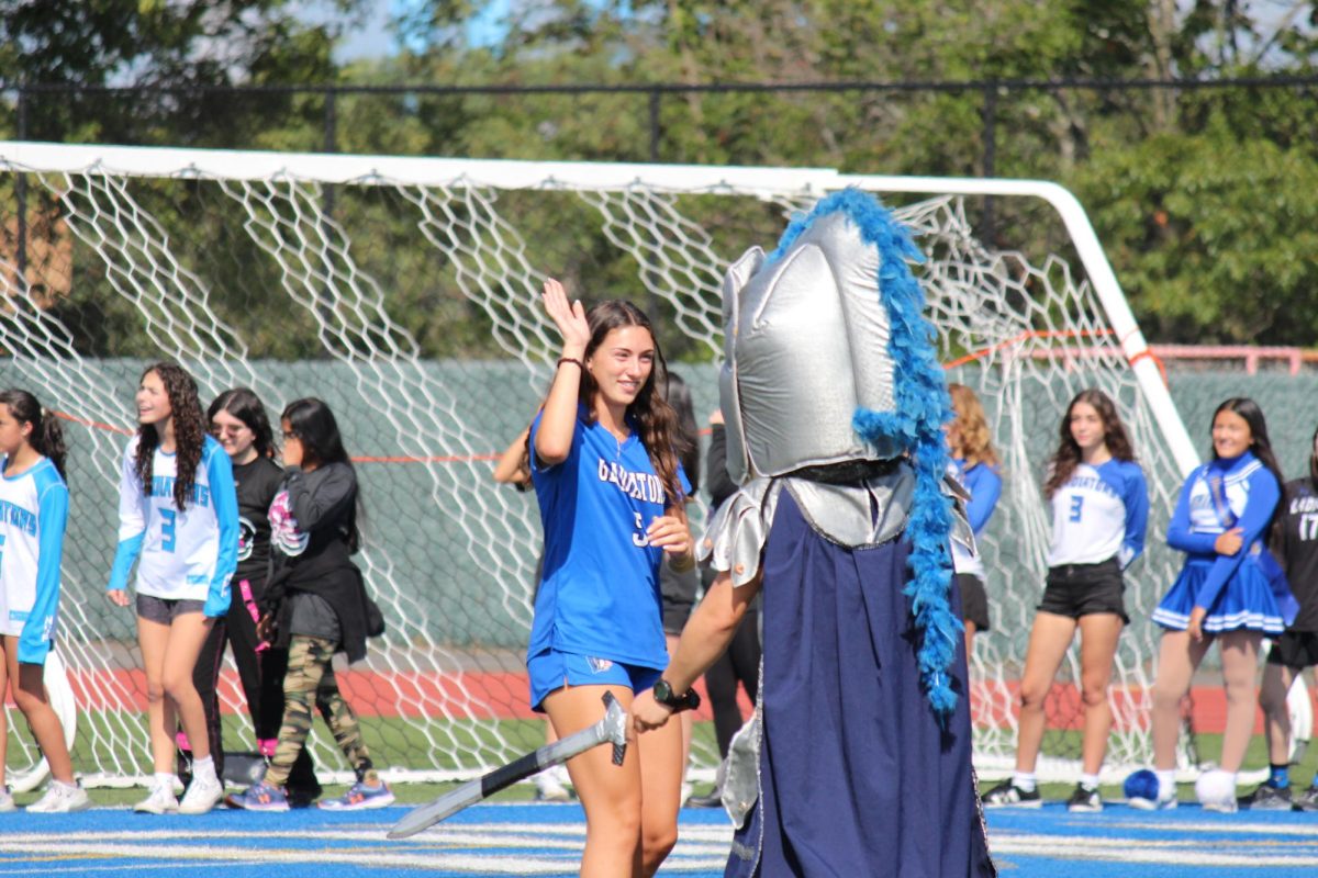 Gladiator greets captain of girls varsity soccer Francesca Curatolo.