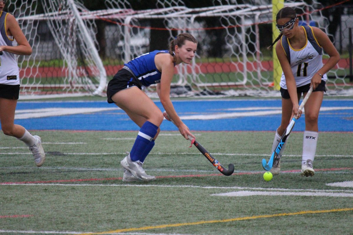 Emily Sepcaru challenges her opponent for possession during New Hyde Park's match against Sewanhaka High School.