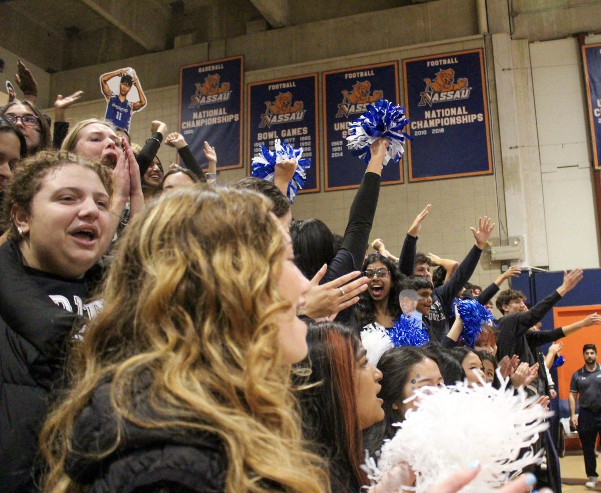 Seniors cheer at the Nassau County Finals as senior year comes into its final stretch, marking some of the last big moments before graduation.
