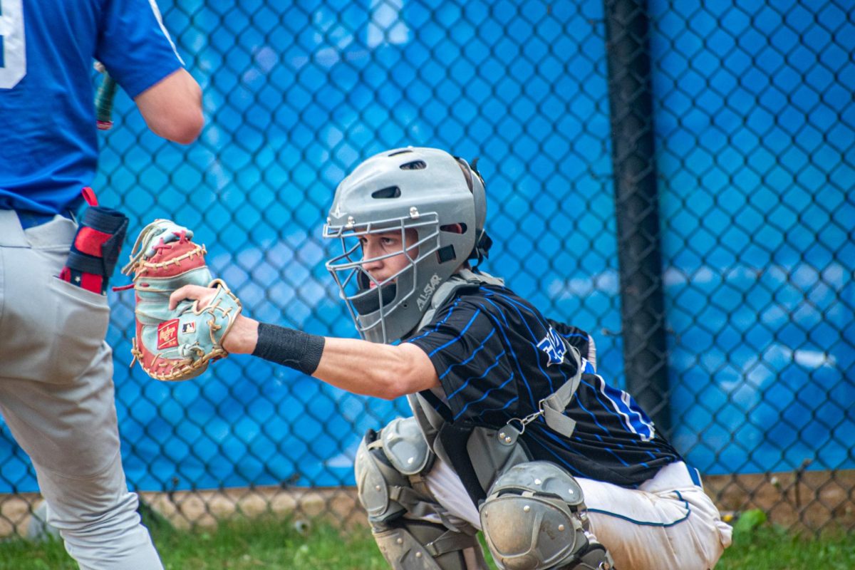 Senior Thomas Giannatsis catches a ball in baseball. 