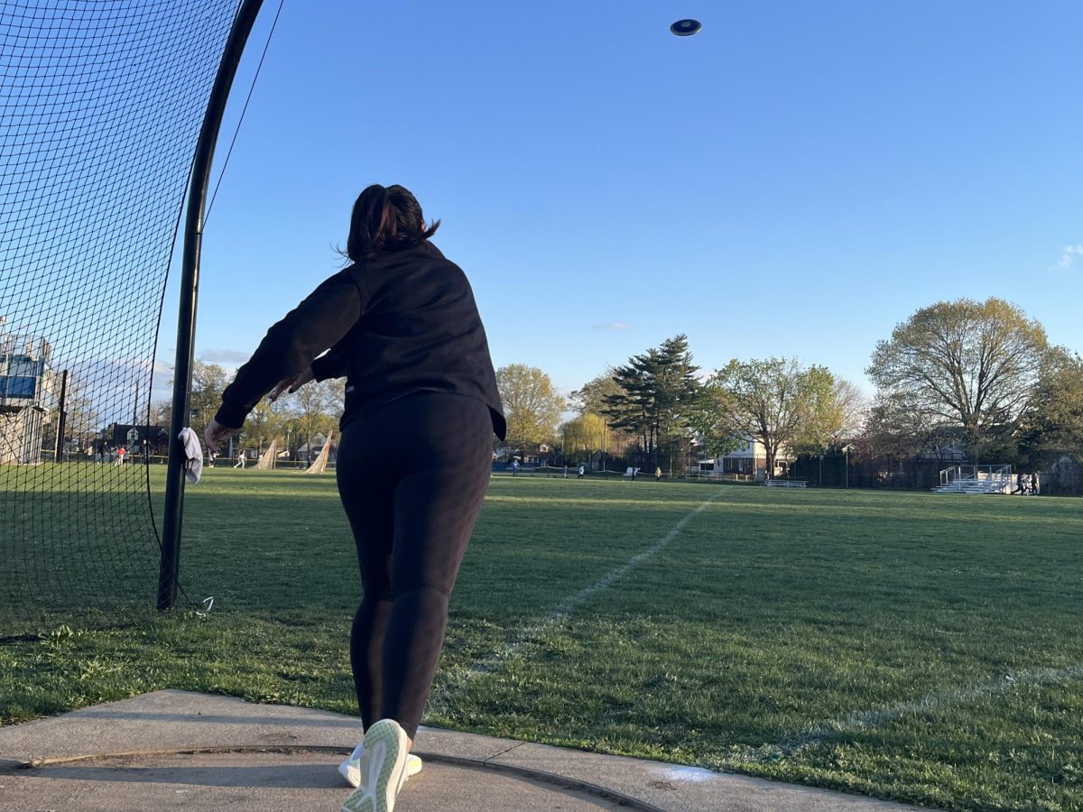 Coach Leydon demonstrating her amazing throwing skills that got her to the Olympics.
